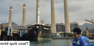 A fisherman looks at the Suralaya coal-fired power plant in Cilegon, Indonesia, in 2023. Ronald Siagian/AFP via Getty Images